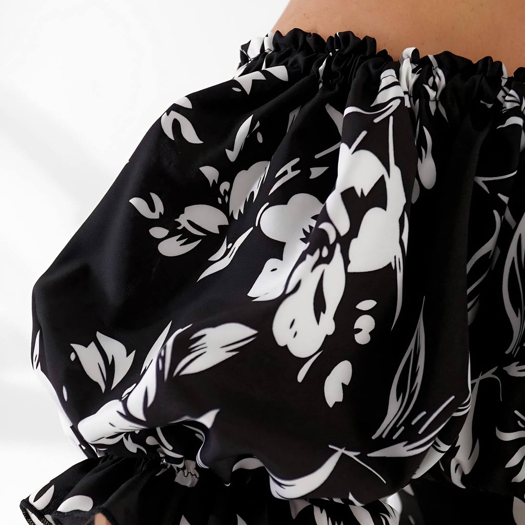 Plus size dress in black floral, lifestyle shot — sharm