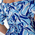 Off-shoulder neckline close-up, plus size dress blue print — sharm