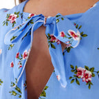 Self-tie waist and floral print close-up, light blue rayon playsuit — sharm