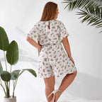 Plus size playsuit in white floral print, back view — sharm