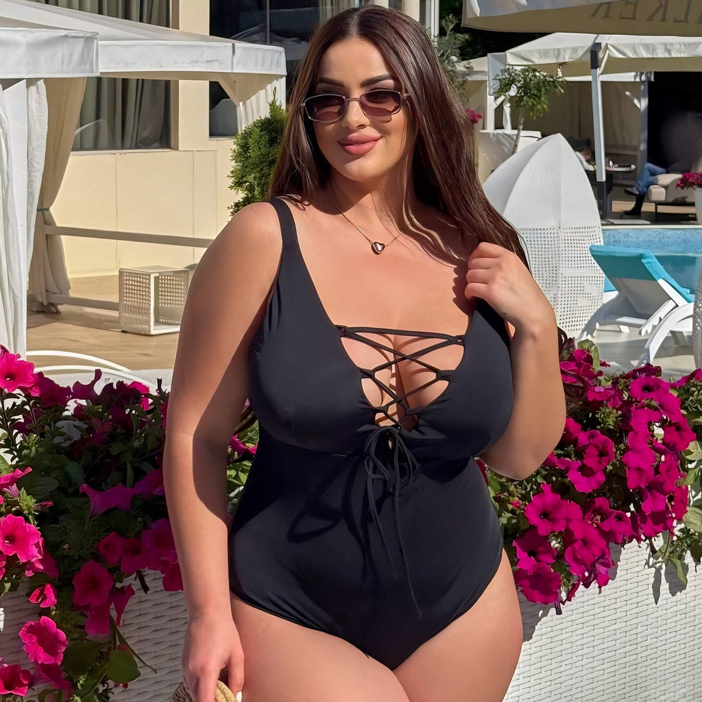 Plus size one-piece swimsuit in black, three-quarter view — sharm