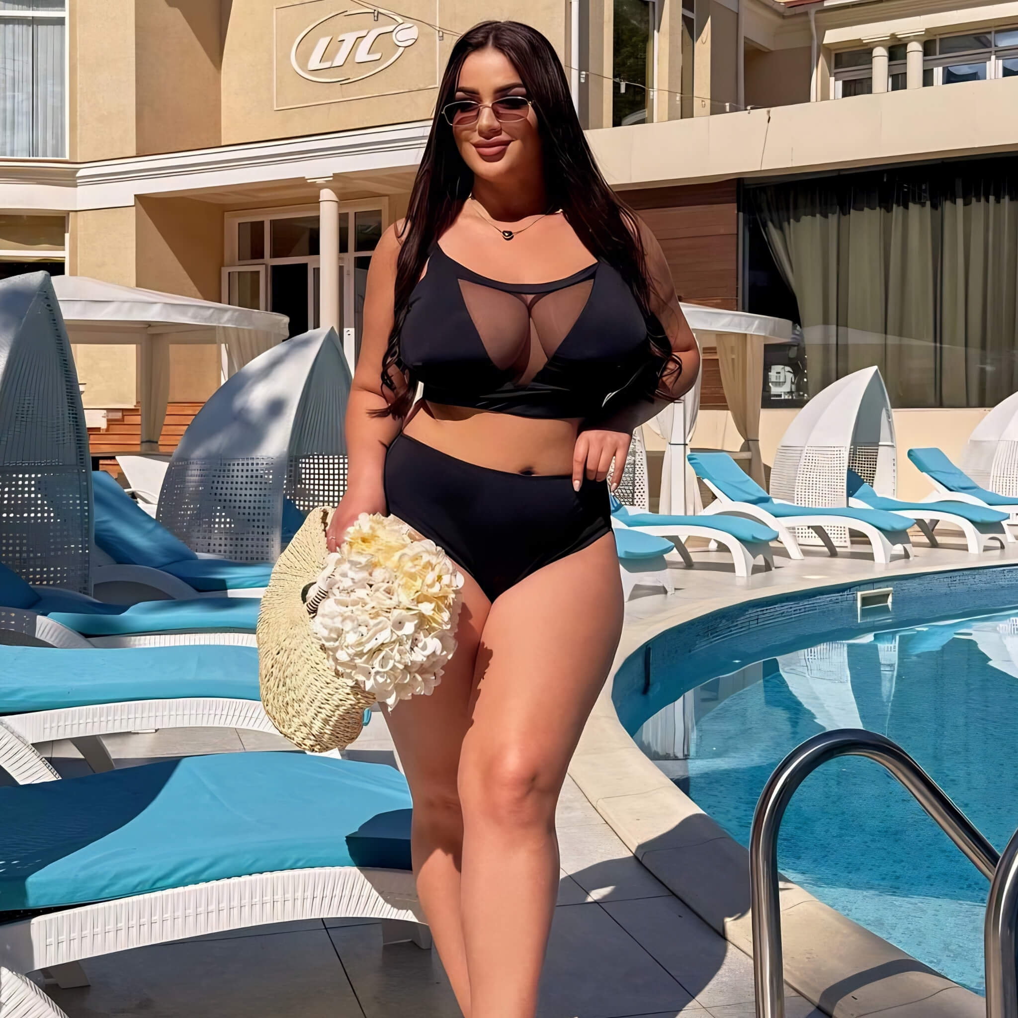 Plus size one-piece swimsuit in black, front view on model — sharm