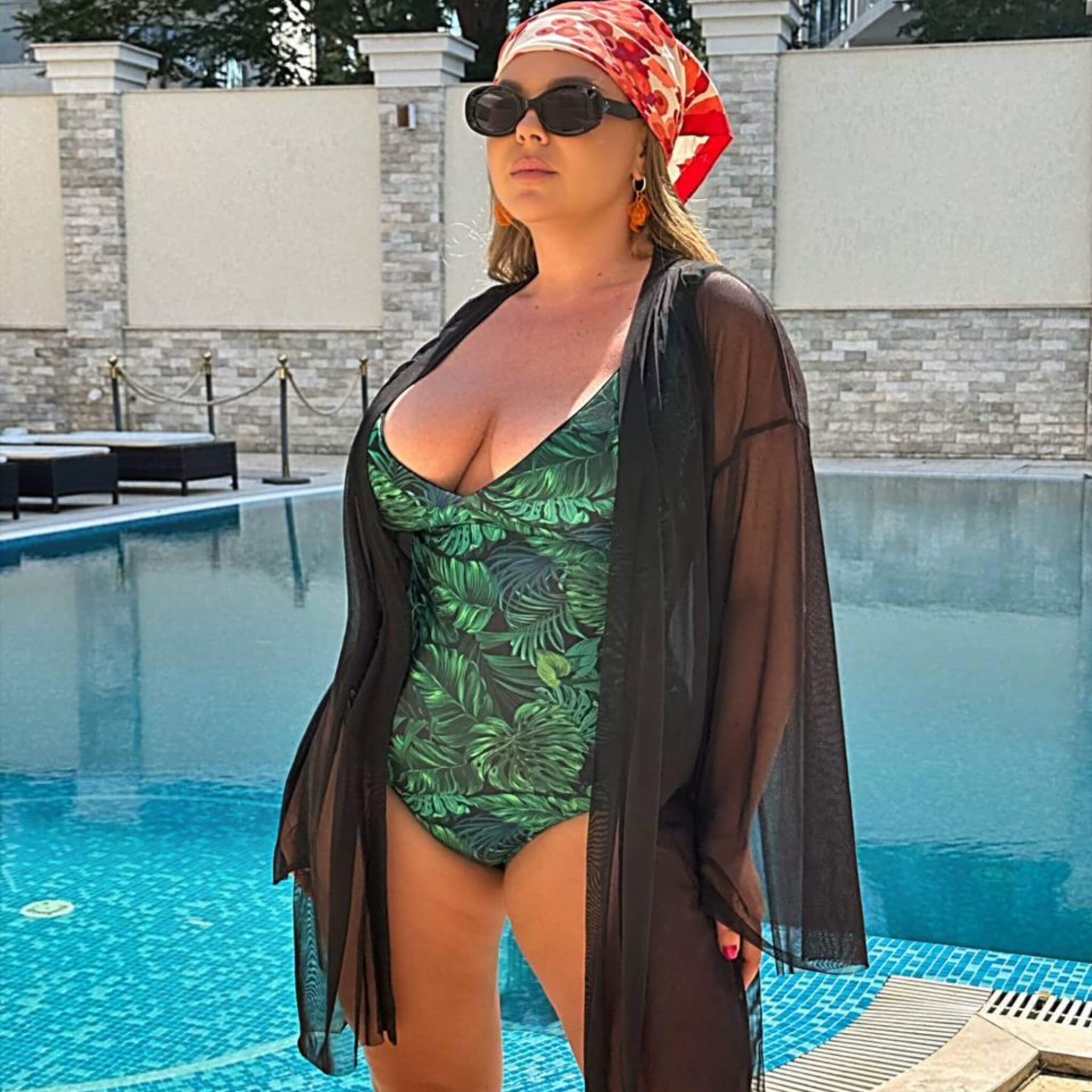 Plus size beach cover-up styled with green one-piece swimsuit — sharm